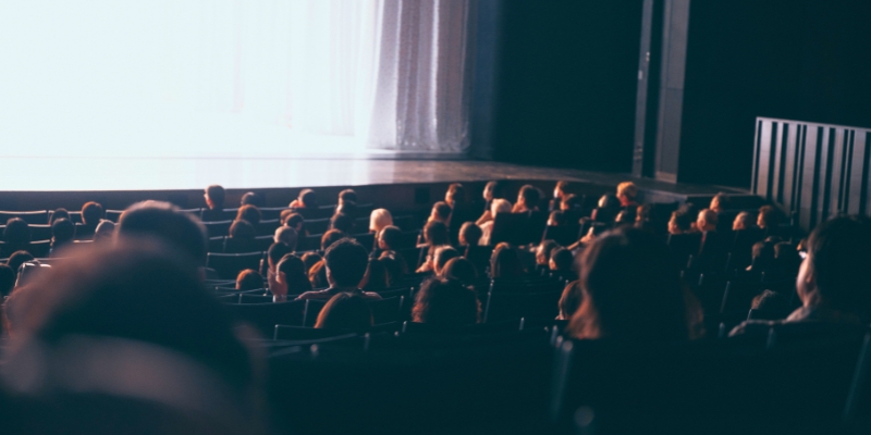 Theater audience captivated by a film screening at the Orlando Film Festival, held in downtown Orlando.