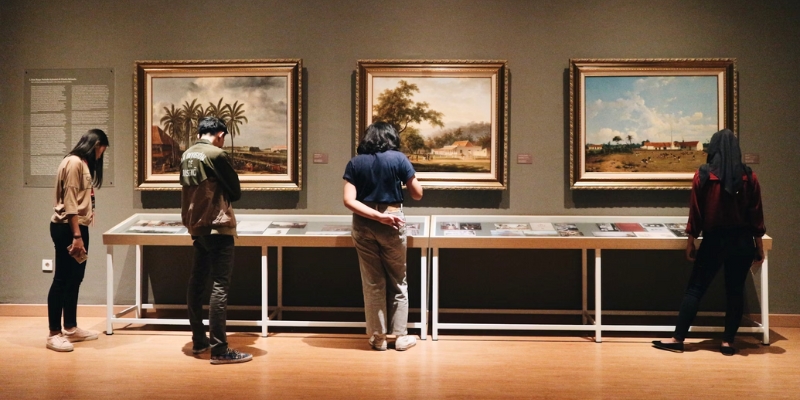 People engage with artwork while exploring the Orange County Regional History Center in downtown Orlando.