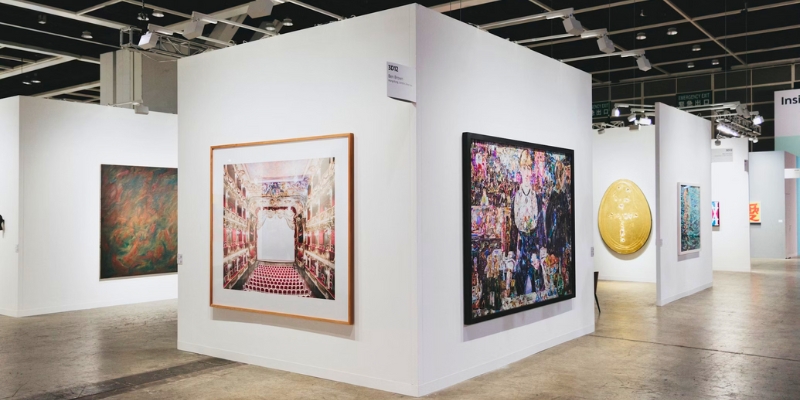 Bright white gallery featuring an array of paintings on display at the Orlando Museum of Art in downtown Orlando.