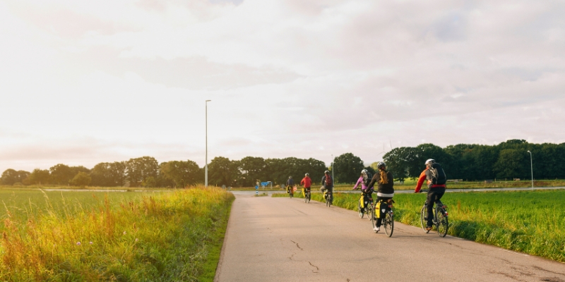 People biking on a path in downtown Orlando, showcasing the vibrant atmosphere of the Orlando Urban Trail.